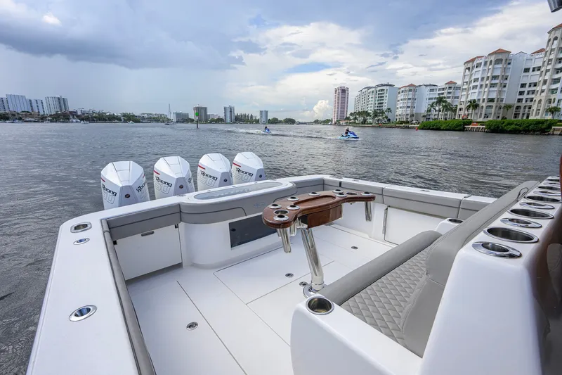 Slide: The Image of Valhalla V-41 boat, 2021 model, with multiple outboard engines on a scenic waterfront. - 26