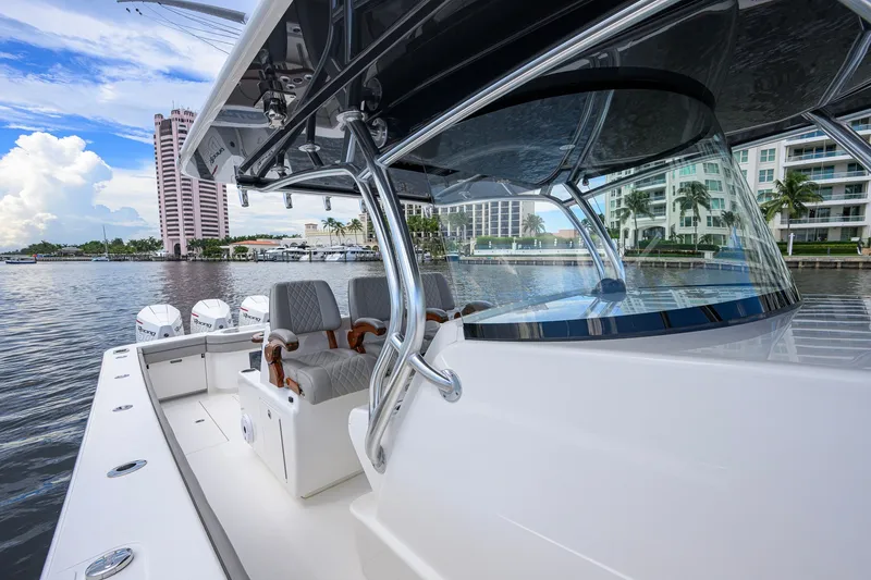 Slide: The Image of 2021 Valhalla V-41 boat docked near waterfront buildings, showcasing sleek design and luxury seating. - 40
