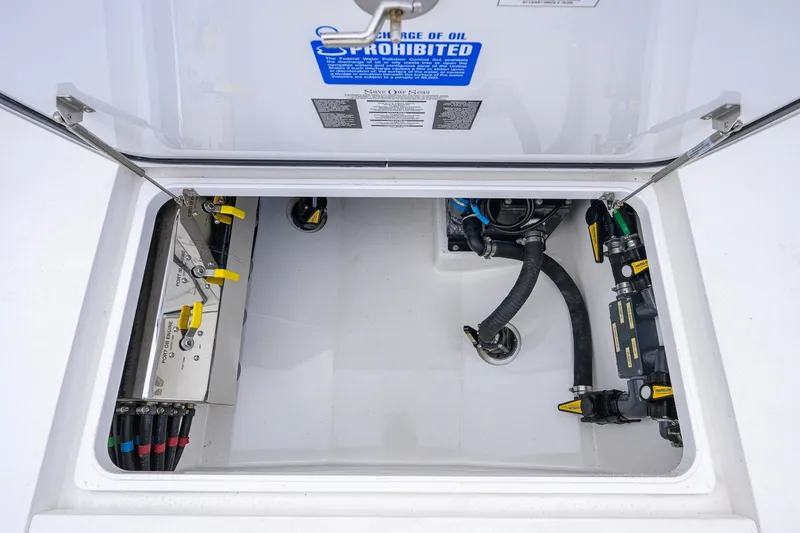Slide: The Image of Valhalla V-41 2021 boat compartment with mechanical components and warning labels. - 65