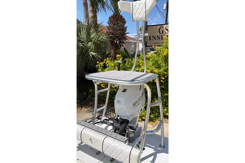 Slide: The Image of 2022 Beavertail Skiffs Mosquito 18' with Suzuki outboard motor, outdoor setting. - 21