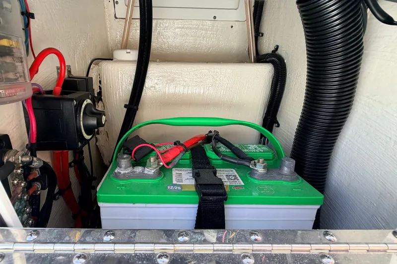 Slide: The Image of Battery compartment of 2022 Beavertail Skiffs Mosquito 18' with wiring and connections. - 16