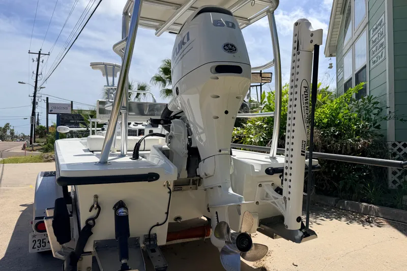 Slide: The Image of 2022 Beavertail Skiffs Mosquito 18' with Suzuki outboard motor, parked on a trailer. - 5