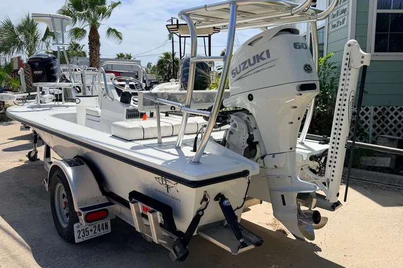 Slide: The Image of 2022 Beavertail Skiffs Mosquito 18' with Suzuki engine, parked outdoors. - 4
