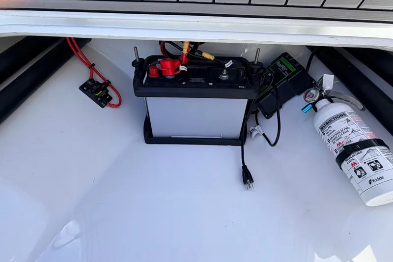 Slide: The Image of Battery compartment of 2022 Beavertail Skiffs Mosquito 18' with fire extinguisher and wiring. - 27