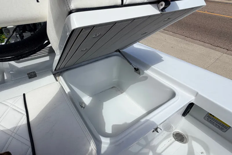 Slide: The Image of Open storage compartment on 2022 Beavertail Skiffs Mosquito 18' boat, showcasing interior space. - 19