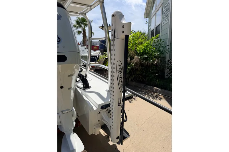 Slide: The Image of 2022 Beavertail Skiffs Mosquito 18' with Power-Pole anchor system, docked outdoors. - 33