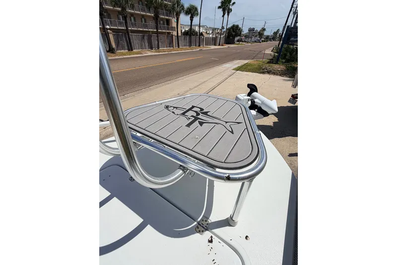 Slide: The Image of 2022 Beavertail Skiffs Mosquito 18' boat platform with logo, parked on a sunny street. - 29