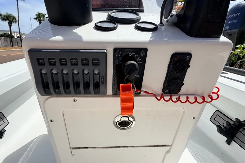 Slide: The Image of 2022 Beavertail Skiffs Mosquito 18' control panel with switches and ignition. - 15