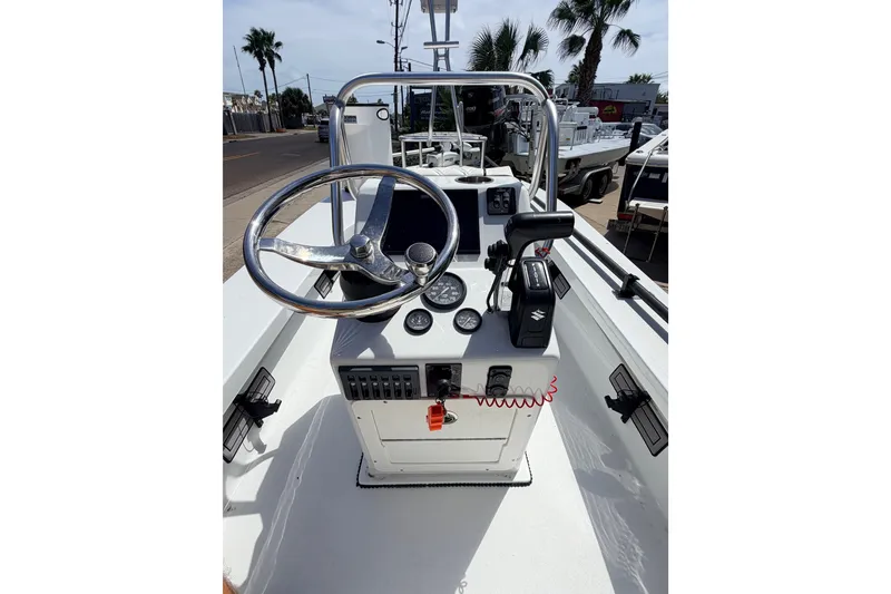 Slide: The Image of 2022 Beavertail Skiffs Mosquito 18' boat console with steering wheel and controls. - 9