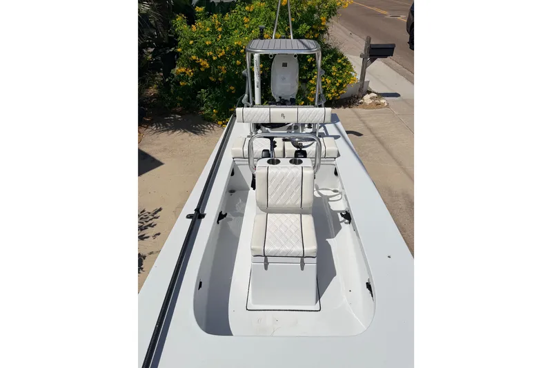 Slide: The Image of 2022 Beavertail Skiffs Mosquito 18' boat with sleek white seating and console. - 30