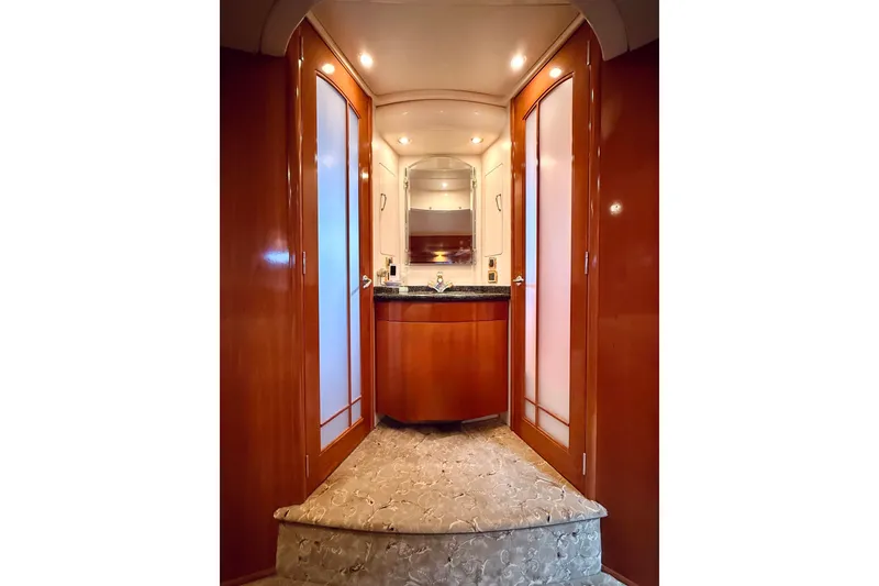 Slide: The Image of Luxurious interior of 2005 Carver 56 Voyager yacht with elegant wood finishes and ambient lighting. - 43