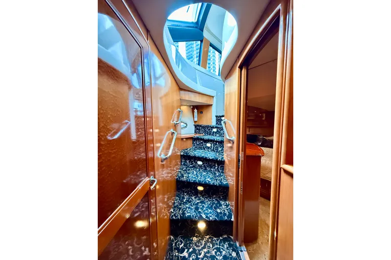 Slide: The Image of Interior staircase of 2005 Carver 56 Voyager yacht with elegant wood finish. - 54