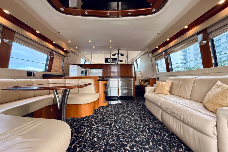 Slide: The Image of Luxurious interior of a 2005 Carver 56 Voyager yacht with elegant seating and modern amenities. - 19