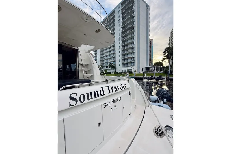 Slide: The Image of 2005 Carver 56 Voyager yacht "Sound Traveler" docked near high-rise buildings. - 6