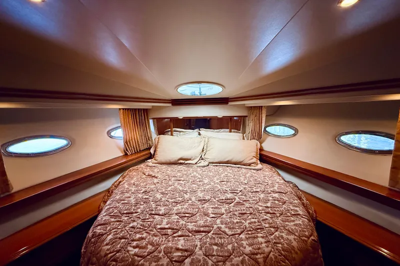 Slide: The Image of Luxurious bedroom interior of 2005 Carver 56 Voyager yacht with elegant bedding. - 45