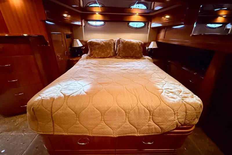Slide: The Image of Luxurious bedroom interior of 2005 Carver 56 Voyager yacht with elegant bedding. - 38