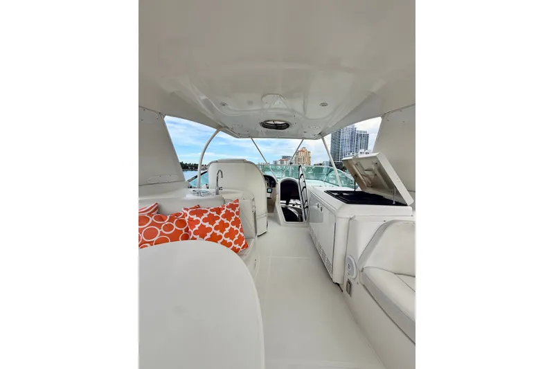 Slide: The Image of Luxurious interior of 2005 Carver 56 Voyager yacht with vibrant orange cushions. - 61
