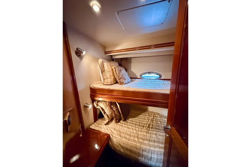 Slide: The Image of Cozy bunk beds in 2005 Carver 56 Voyager yacht cabin with elegant wood finish. - 50