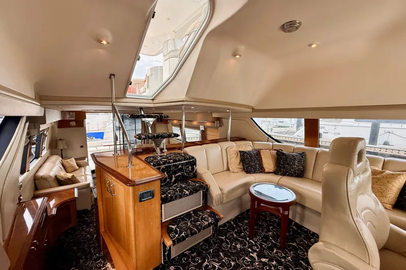 Slide: The Image of Luxurious interior of a 2005 Carver 56 Voyager yacht with elegant seating and decor. - 29