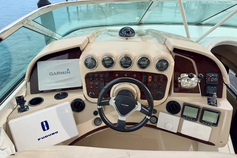 Slide: The Image of Helm of 2005 Carver 56 Voyager yacht with Garmin and Furuno navigation systems. - 67