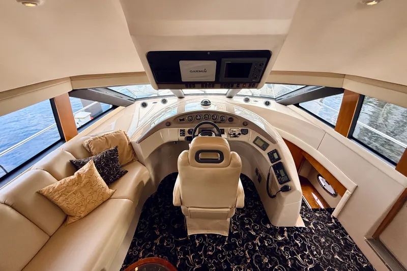 Slide: The Image of Luxurious interior of a 2005 Carver 56 Voyager yacht with plush seating and advanced navigation. - 31