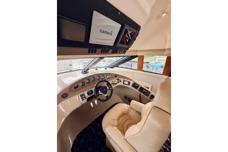 Slide: The Image of Interior helm of 2005 Carver 56 Voyager yacht with Garmin navigation system. - 32