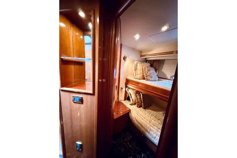 Slide: The Image of Luxurious interior of 2005 Carver 56 Voyager yacht with cozy bunk beds. - 51