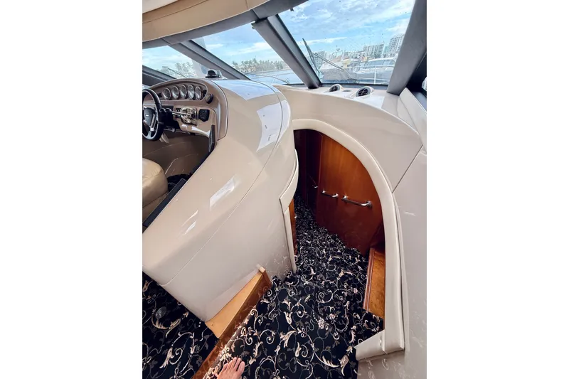 Slide: The Image of Interior view of 2005 Carver 56 Voyager yacht helm with elegant design and controls. - 35