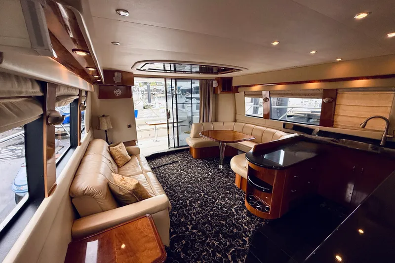 Slide: The Image of Luxurious interior of a 2005 Carver 56 Voyager yacht with elegant seating and modern amenities. - 26