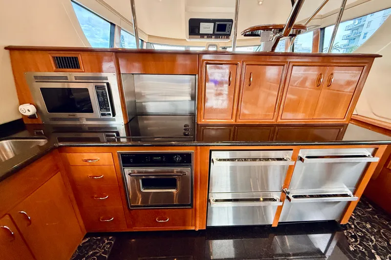 Slide: The Image of Luxurious kitchen interior of 2005 Carver 56 Voyager yacht with modern appliances. - 25