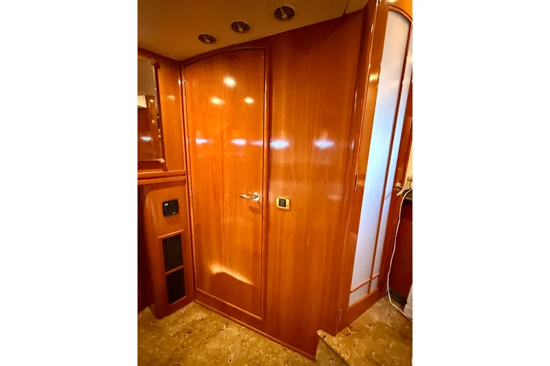 Slide: The Image of Interior of 2005 Carver 56 Voyager yacht with polished wooden door and elegant design. - 41