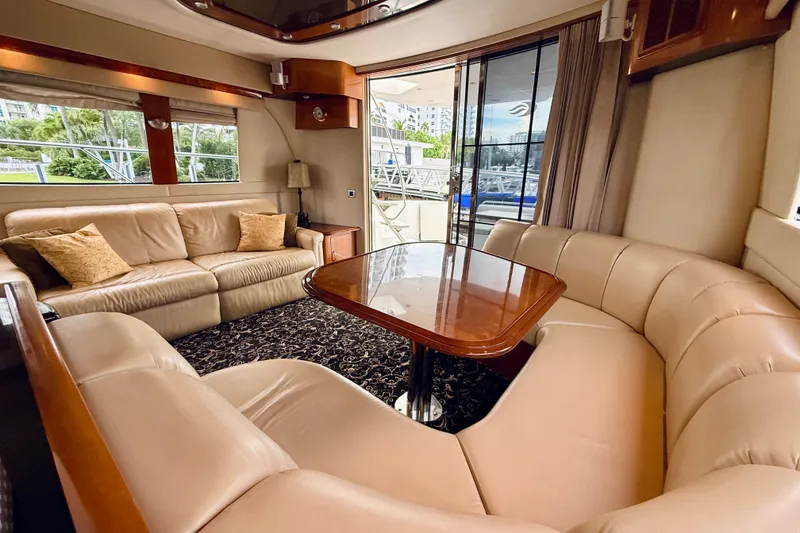 Slide: The Image of Luxurious interior of a 2005 Carver 56 Voyager yacht with plush seating and elegant decor. - 22