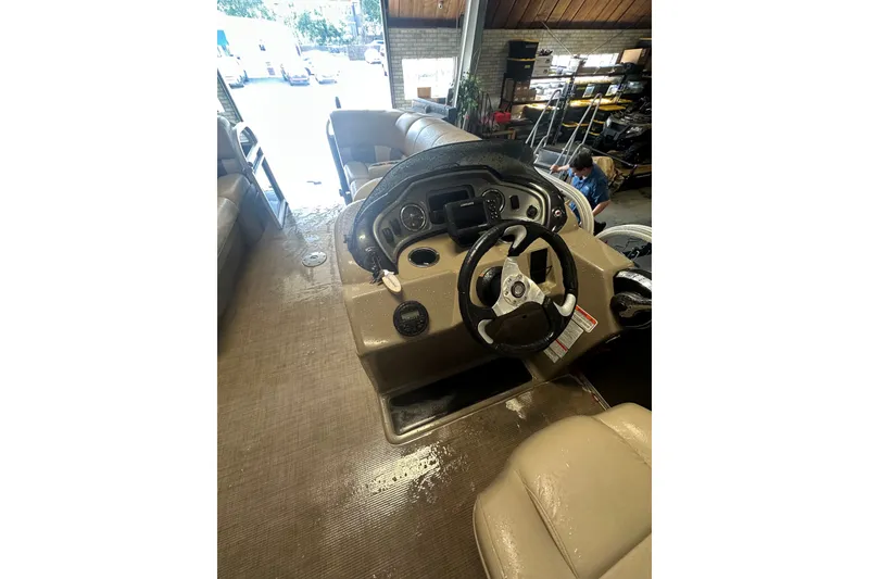 Slide: The Image of 2020 Sun Tracker Party Barge 22 DLX interior with steering console and seating. - 13