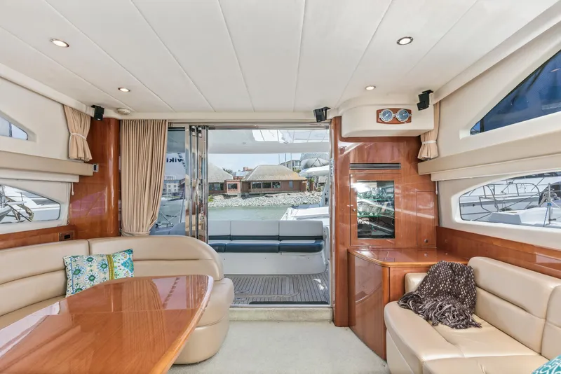Slide: The Image of Luxurious interior of 2007 Viking Sport Cruiser yacht with elegant seating and wooden finishes. - 14