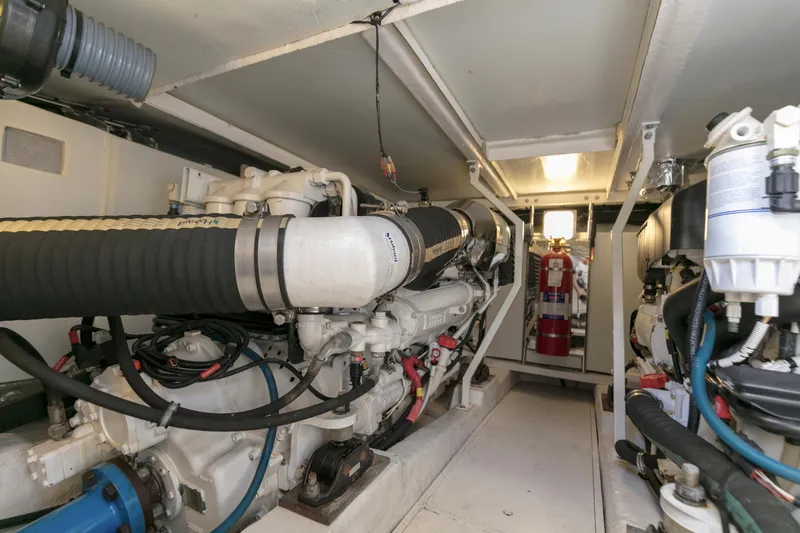 Slide: The Image of Engine room of 2007 Viking Sport Cruiser with visible machinery and equipment. - 48