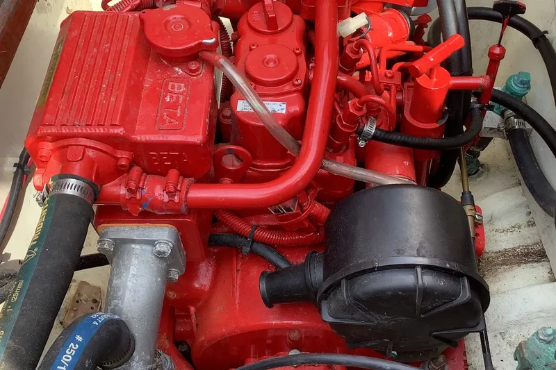 Slide: The Image of Red engine of a 1975 Halberg Rassey P-28 boat, featuring Beta Marine components. - 17