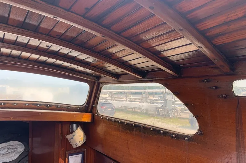 Slide: The Image of Interior of 1975 Halberg Rassey P-28 boat with wooden paneling and windows. - 33