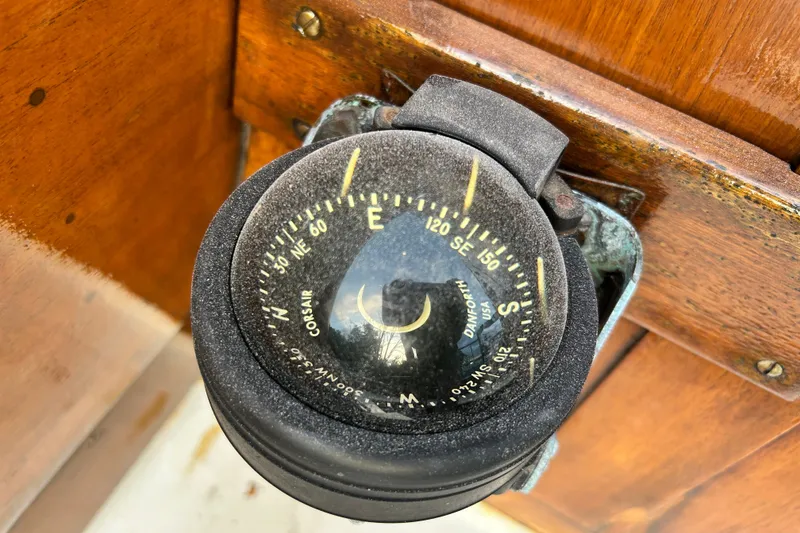 Slide: The Image of Vintage compass on 1975 Halberg Rassey P-28 boat, mounted on wooden panel. - 44