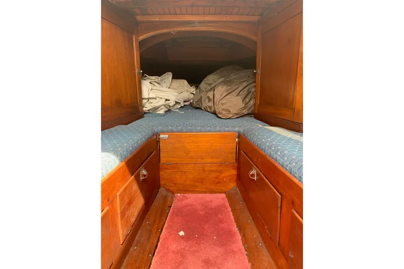 Slide: The Image of Interior cabin of 1975 Halberg Rassey P-28 sailboat with wooden finish and bedding. - 32