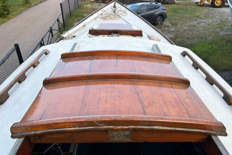 Slide: The Image of Deck view of a 1975 Halberg Rassey P-28 sailboat with wooden hatch covers. - 15