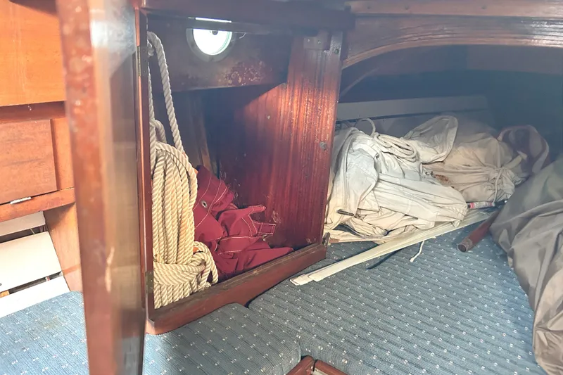 Slide: The Image of Interior of a 1975 Halberg Rassey P-28 sailboat with ropes and sails stored. - 37