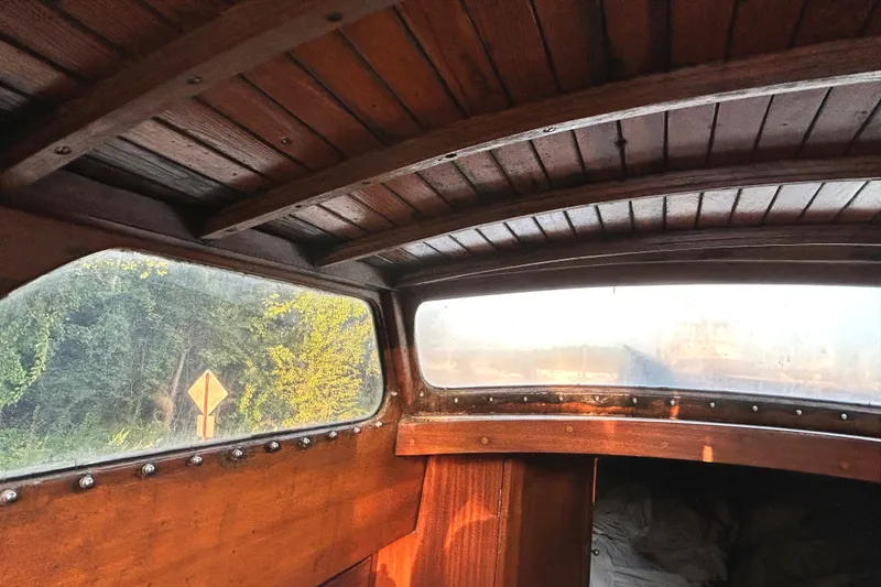 Slide: The Image of Interior view of a 1975 Halberg Rassey P-28 boat with wooden paneling. - 41