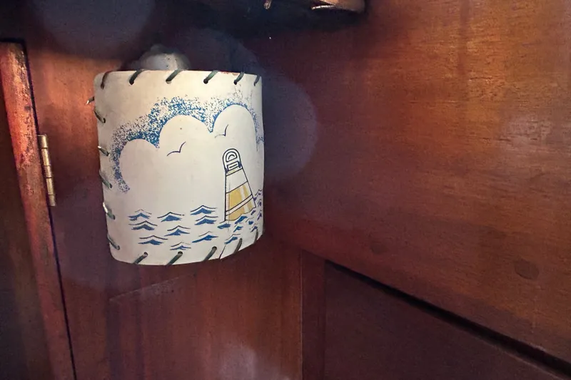 Slide: The Image of Vintage nautical-themed lamp inside 1975 Halberg Rassey P-28 boat cabin. - 43