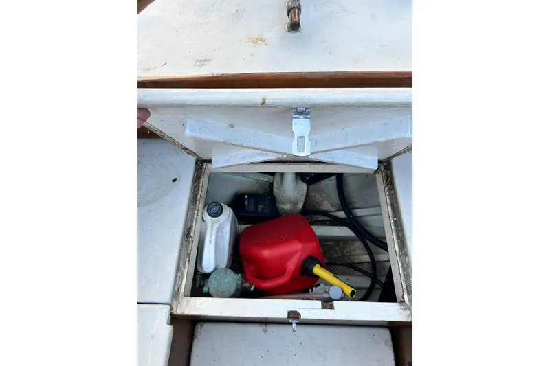 Slide: The Image of Storage compartment of 1975 Halberg Rassey P-28 boat with fuel containers and equipment. - 49