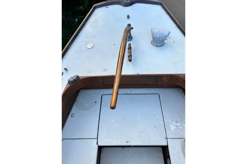 Slide: The Image of 1975 Halberg Rassey P-28 sailboat deck with wooden tiller and hatch. - 14