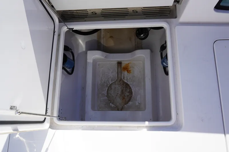 Slide: The Image of Open storage compartment on 2026 Sportsman Open 302 Center Console boat. - 20