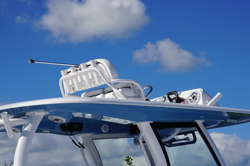 Slide: The Image of 2026 Sportsman Open 302 Center Console boat against a clear blue sky. - 28