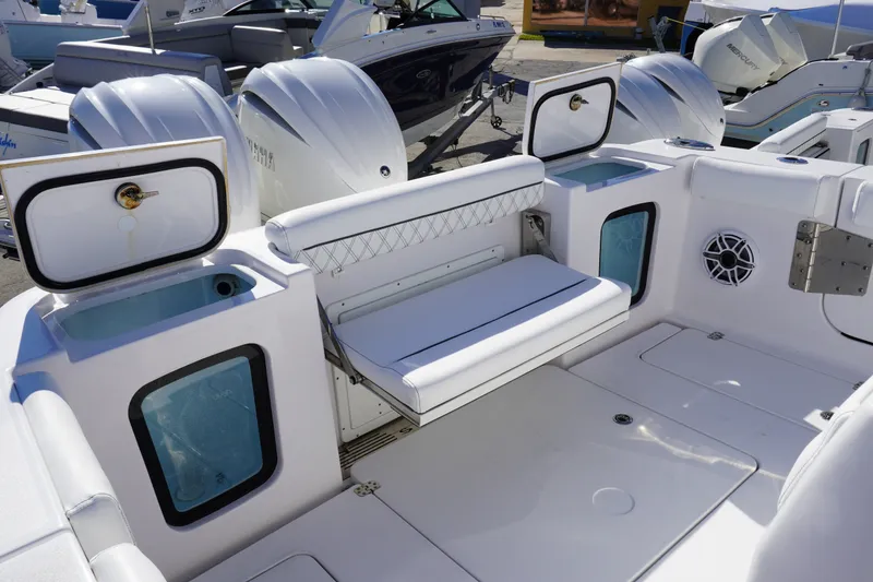 Slide: The Image of 2026 Sportsman Open 302 Center Console boat interior with seating and storage compartments. - 18