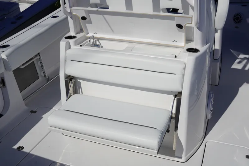 Slide: The Image of 2026 Sportsman Open 302 Center Console boat seating area with white cushioned seats. - 14