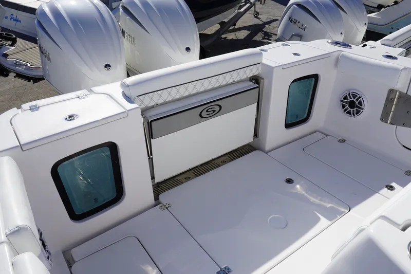Slide: The Image of 2026 Sportsman Open 302 Center Console boat interior with seating and storage compartments. - 17